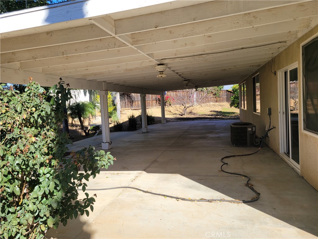 25540 Turfwood Street Menifee, CA 92585 - Photo 10 of 27 a view of a porch with furniture