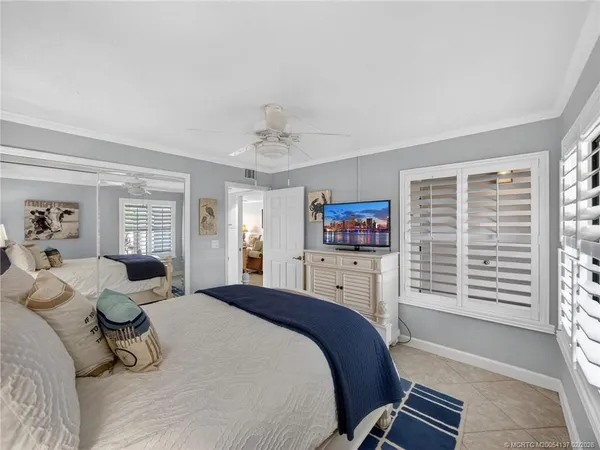 a bed room with a bed and a television