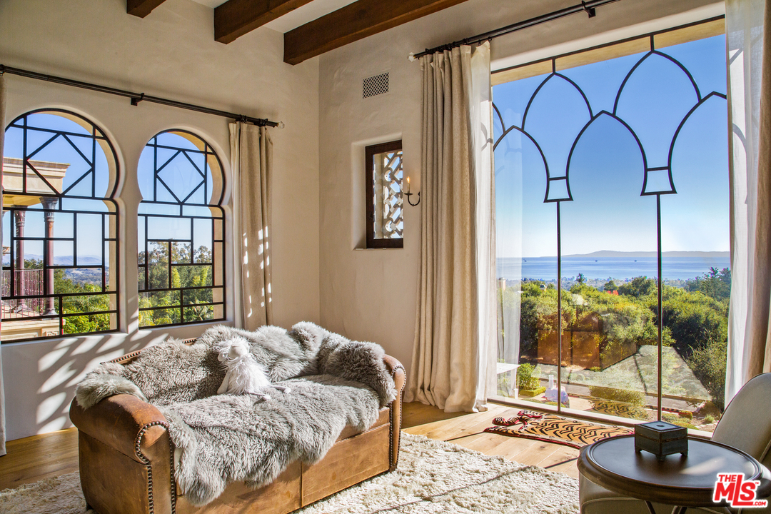 848 Hot Springs Road Santa Barbara, CA 93108 - Photo 17 of 26 a living room with furniture and a floor to ceiling window