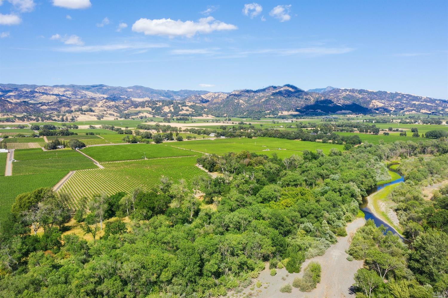 5403 Highway 128 Geyserville, CA 95441 - Photo 1 of 1 a view of a lush green field with mountains in the background