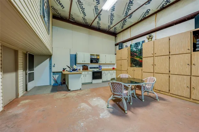 a view of a kitchen with furniture and a kitchen