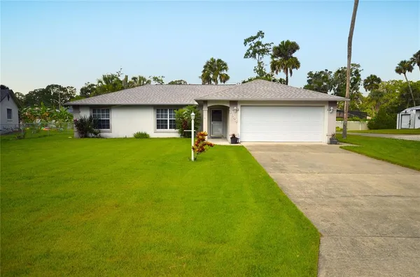 a view of a house with a yard