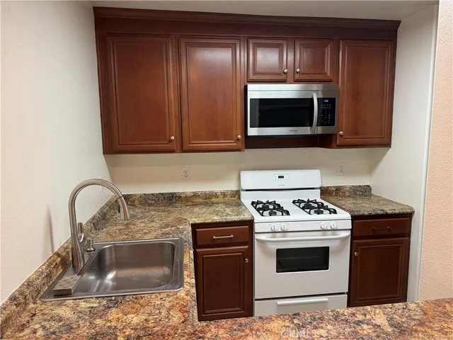 a kitchen with a stove and a microwave