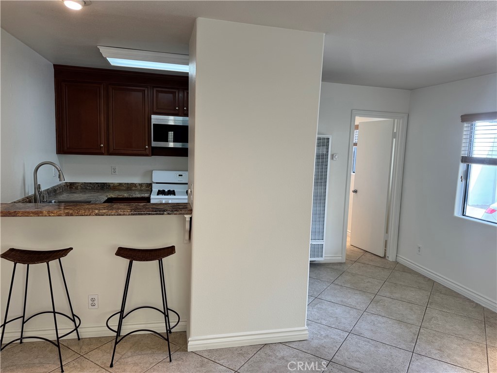 33966 Malaga Drive, Unit B Dana Point, CA 92629 - Photo 5 of 25 a kitchen with stainless steel appliances a sink and a refrigerator