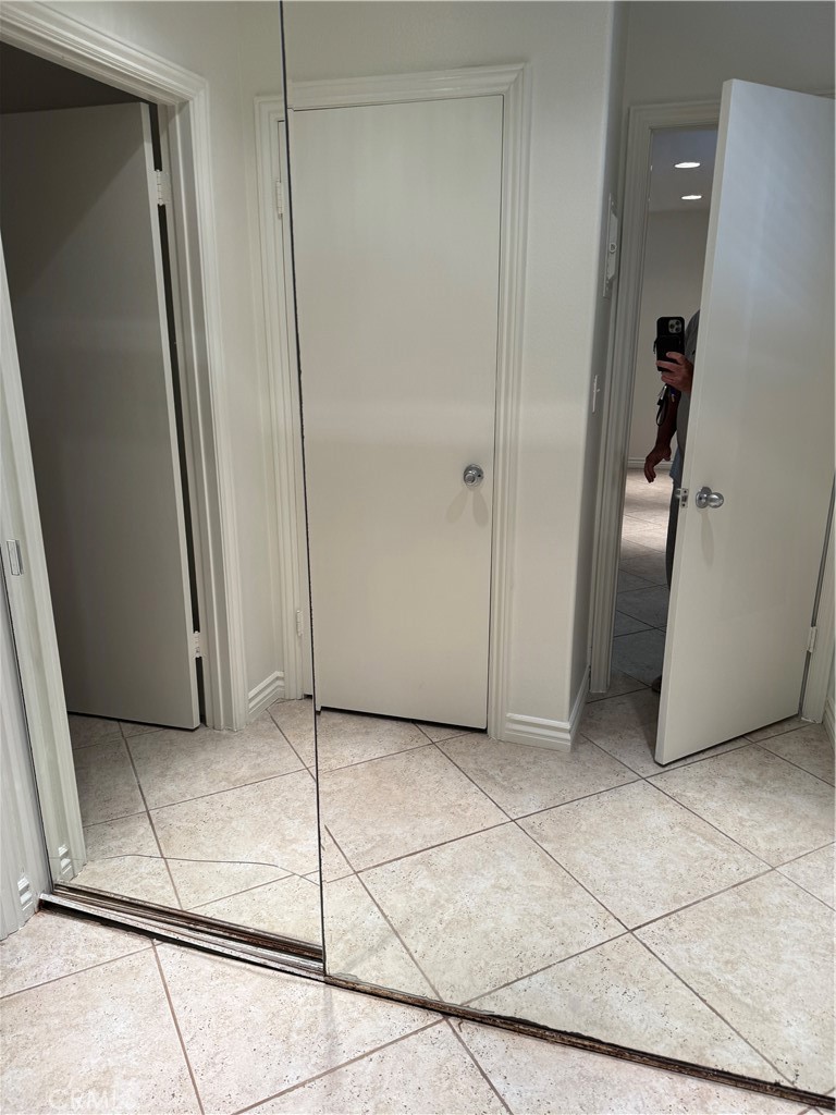 33966 Malaga Drive, Unit B Dana Point, CA 92629 - Photo 8 of 25 a view of a refrigerator in kitchen and an empty room