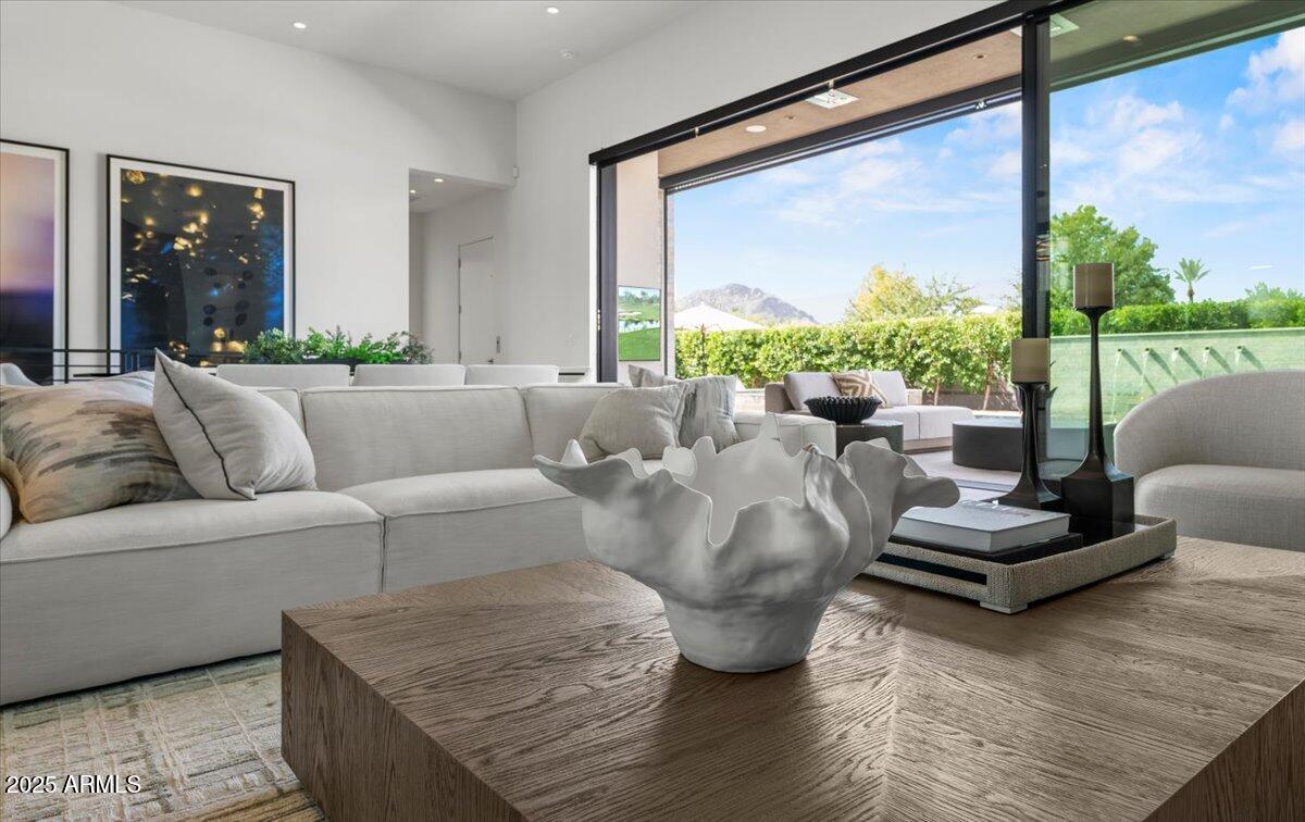 6802 East Joshua Tree Lane Paradise Valley, AZ 85253 - Photo 10 of 70 a living room with furniture and a large window