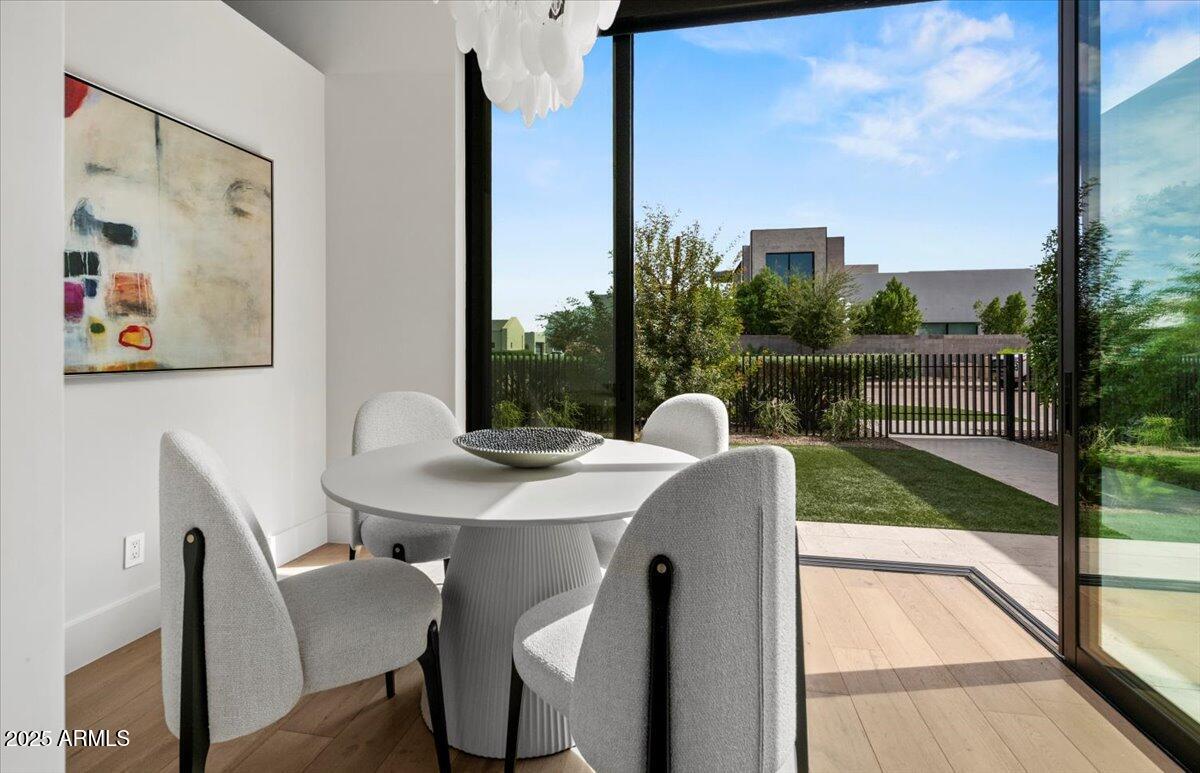 6802 East Joshua Tree Lane Paradise Valley, AZ 85253 - Photo 16 of 70 a view of a dining room with a table and chairs