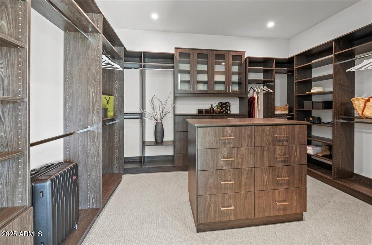 6802 East Joshua Tree Lane Paradise Valley, AZ 85253 - Photo 28 of 70 a kitchen with stainless steel appliances granite countertop a refrigerator and a stove top oven