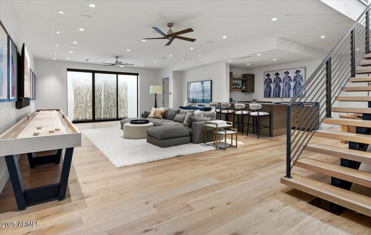 6802 East Joshua Tree Lane Paradise Valley, AZ 85253 - Photo 37 of 70 a living room with furniture and wooden floor