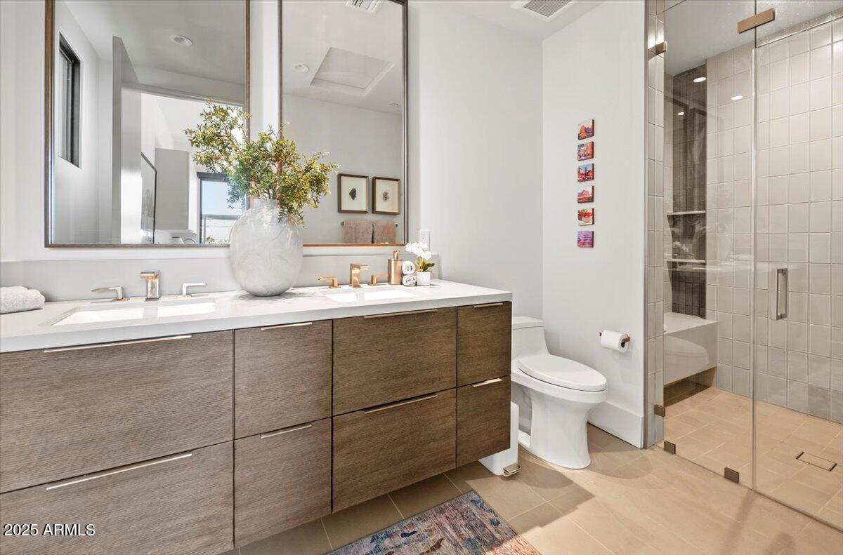 6802 East Joshua Tree Lane Paradise Valley, AZ 85253 - Photo 48 of 70 a bathroom with a sink toilet and shower