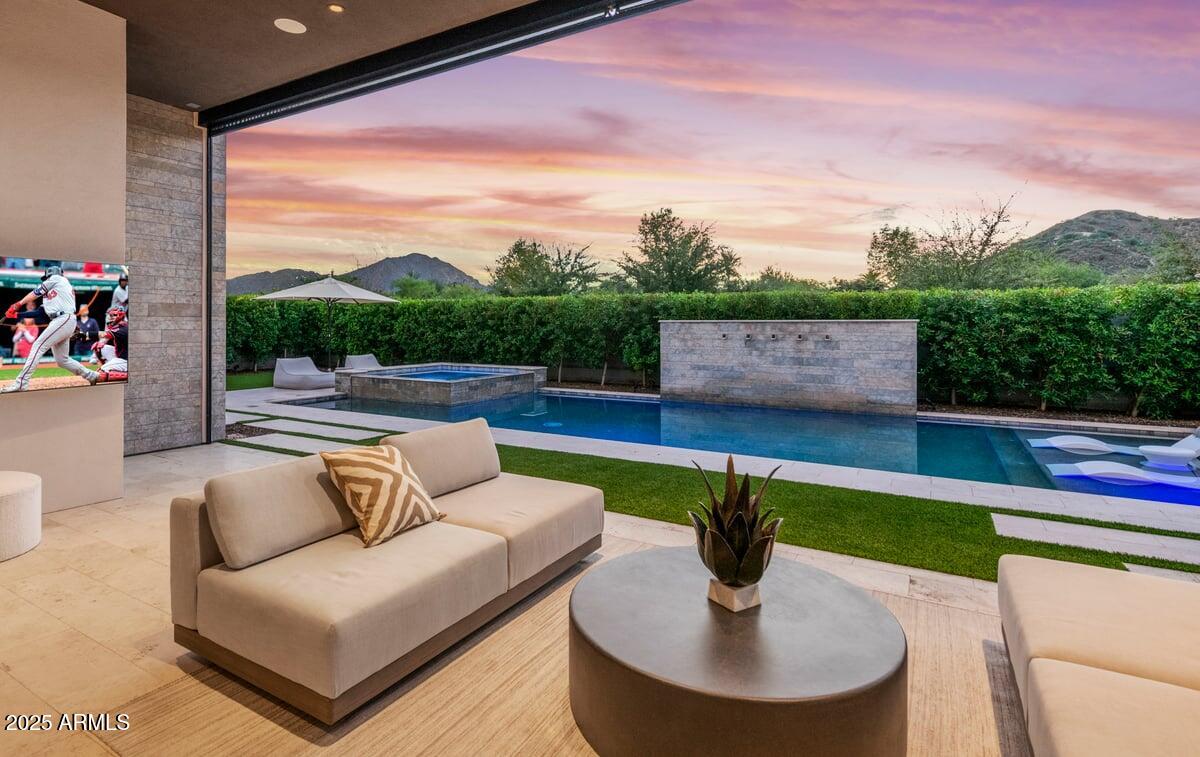 6802 East Joshua Tree Lane Paradise Valley, AZ 85253 - Photo 58 of 70 a view of a patio with couches and a table and chairs