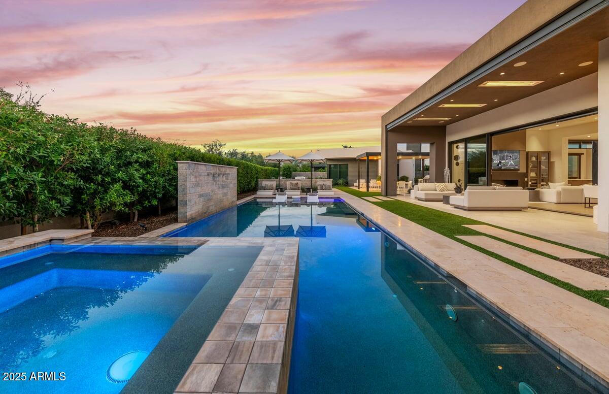6802 East Joshua Tree Lane Paradise Valley, AZ 85253 - Photo 62 of 70 a view of swimming pool with seating area