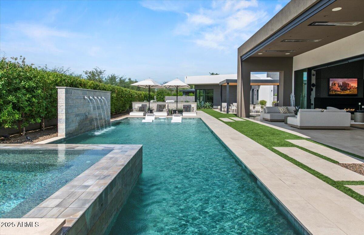 6802 East Joshua Tree Lane Paradise Valley, AZ 85253 - Photo 64 of 70 a view of a house with backyard porch and sitting area