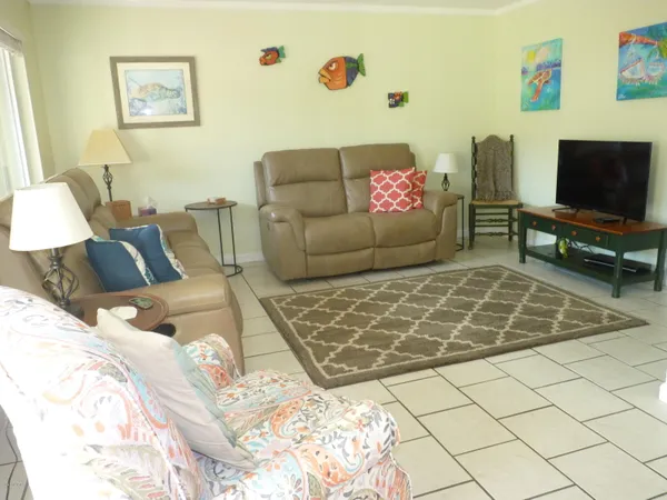 a living room with furniture and a window