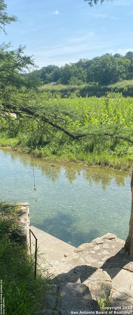 a view of a lake with a yard