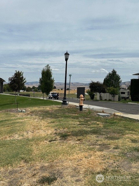 285 Arabica Road Walla Walla, WA 99362 - Photo 1 of 5 a view of a lake with a big yard
