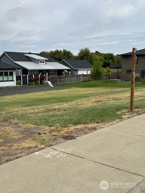 285 Arabica Road Walla Walla, WA 99362 - Photo 3 of 5 a aerial view of a house with a big yard and potted plants