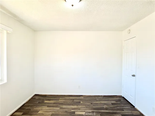 a view of a parking space in front of a building