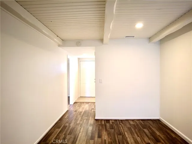 a view of hallway with wooden floor