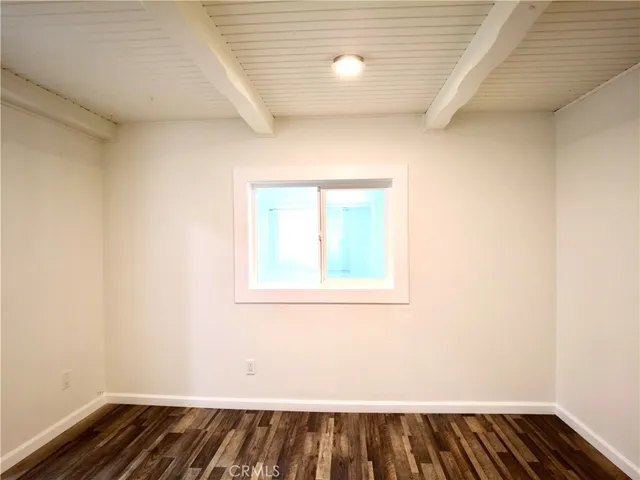 a spacious bathroom with a double vanity sink a mirror and a shower
