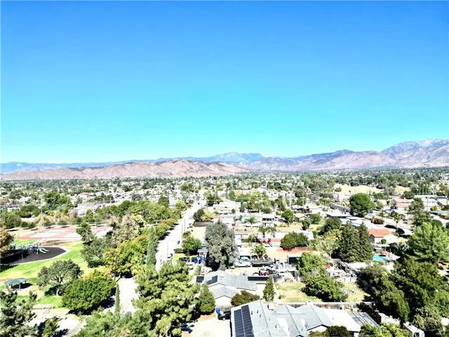 a view of a house with palm trees