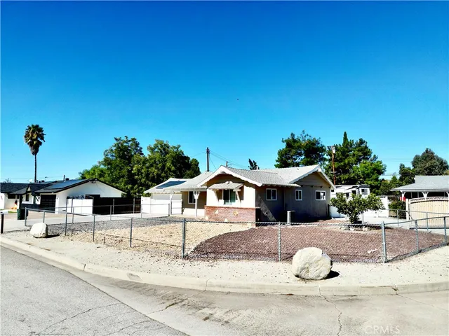 a house with a yard and seating space