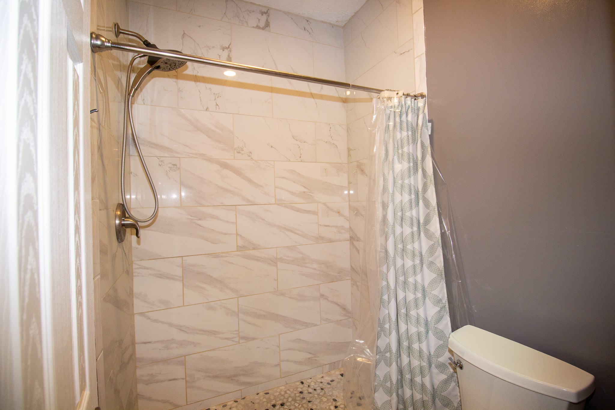 1245 4th Street Hempstead, TX 77445 - Photo 16 of 24 a bathroom with a shower and a toilet