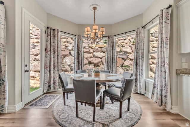2543 East 700 South Springville, UT 84663 - Photo 27 of 73 Dining area with a chandelier and light wood-style flooring