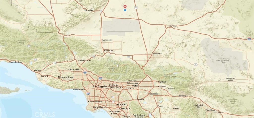 0 Duquesne Street Edwards, CA 93523 - Photo 10 of 10 a white bed with a white comforter and pillows