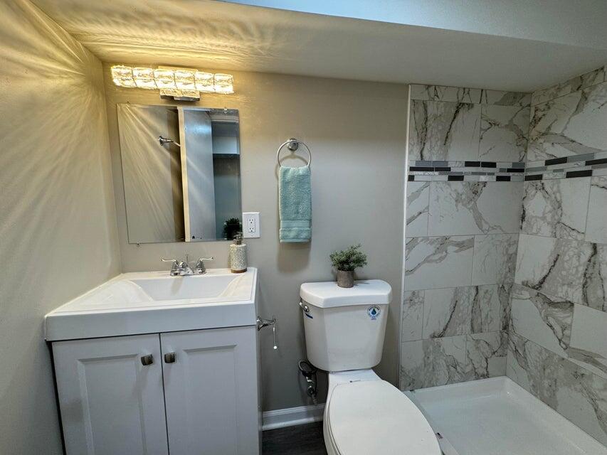 6910 Ash Avenue Gary, IN 46403 - Photo 19 of 27 a bathroom with a toilet sink and mirror
