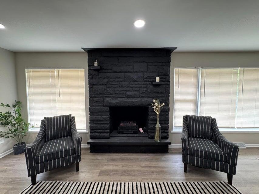 6910 Ash Avenue Gary, IN 46403 - Photo 5 of 27 a living room with furniture a rug and a fireplace
