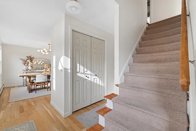a view of entryway and hall with dining room