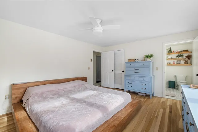 a bedroom with a bed and a dresser