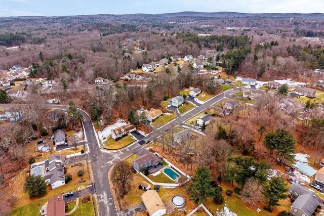 an aerial view of residential house and sandy dunes