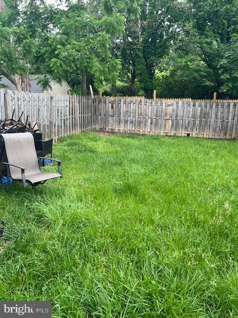 44 Reading Avenue Trenton, NJ 08618 - Photo 10 of 11 a view of a chair and yard with wooden fence