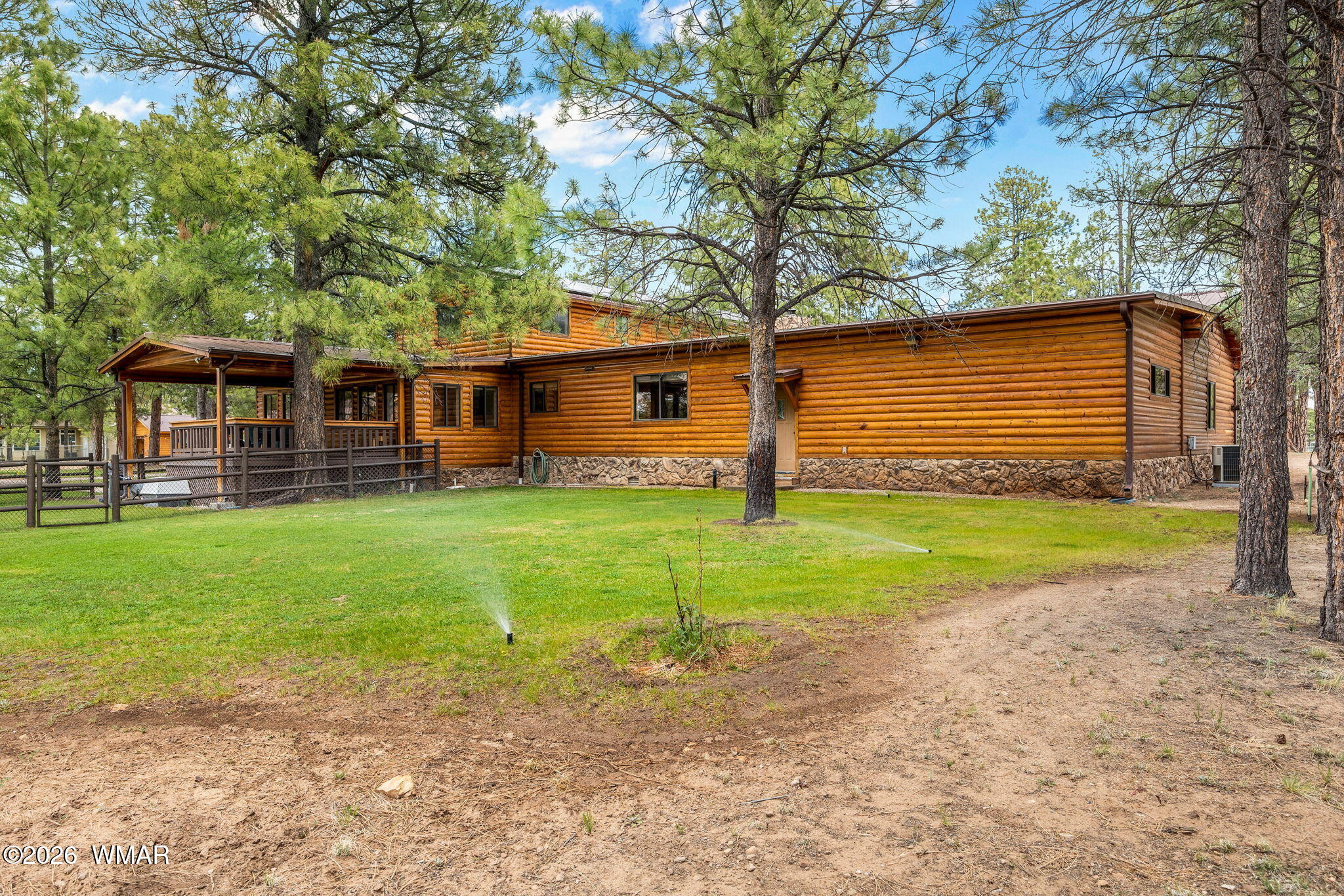2922 Pine Rim Road Overgaard, AZ 85933 - Photo 45 of 58 a front view of house with yard and green space