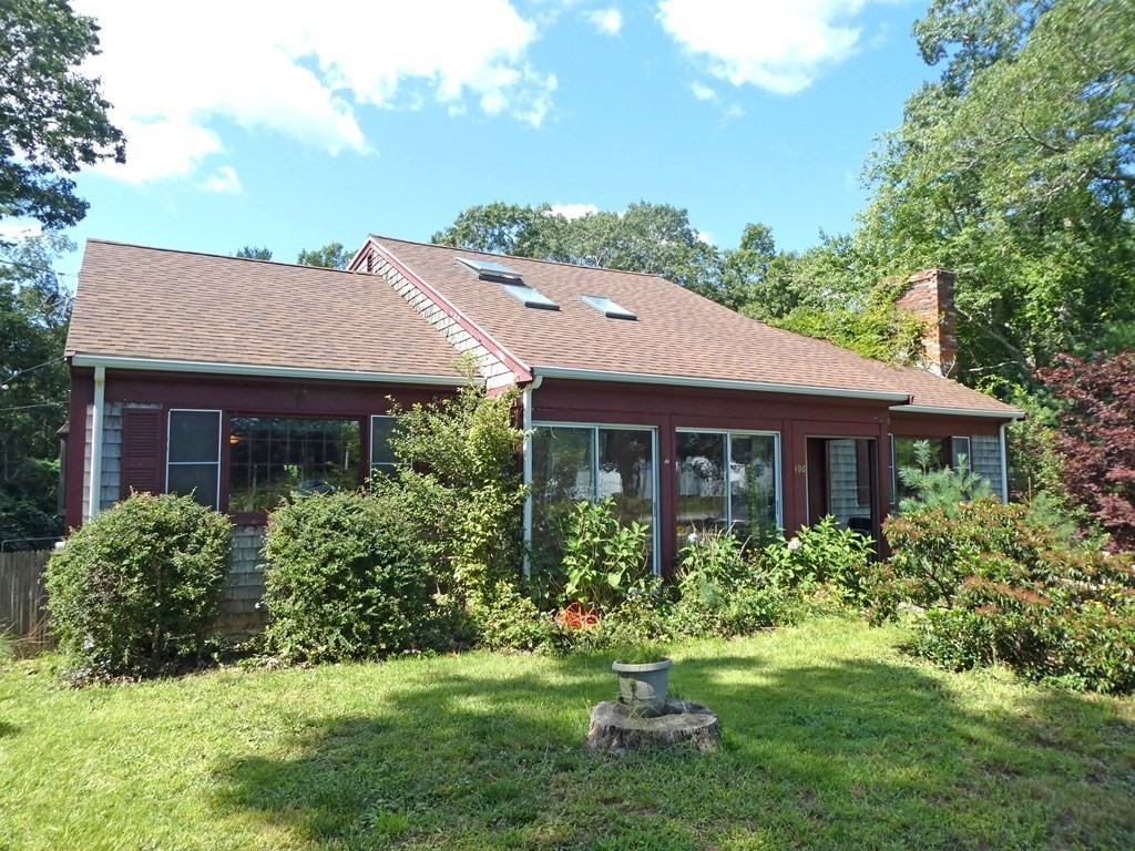 496 Wareham Street Middleboro, MA 02346 - Photo 1 of 34 a aerial view of a house with a yard and potted plants