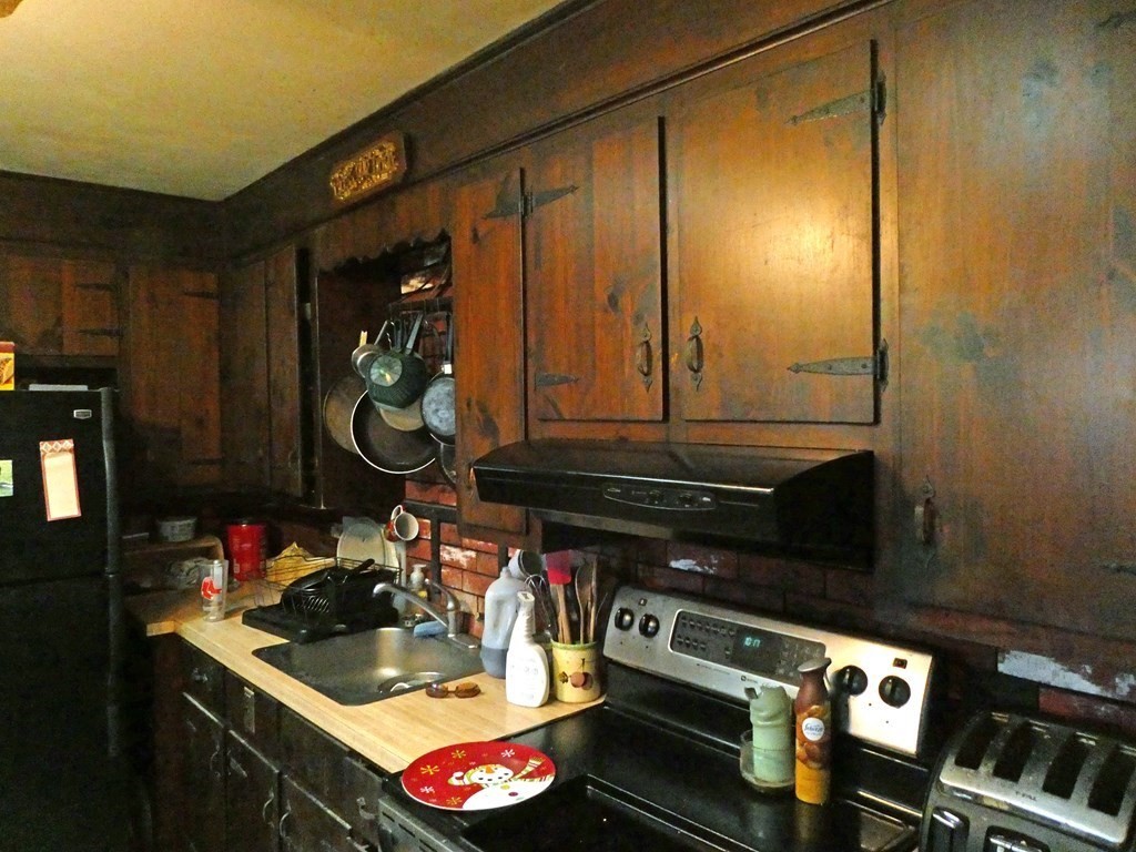 496 Wareham Street Middleboro, MA 02346 - Photo 13 of 34 a kitchen with a sink and cabinets