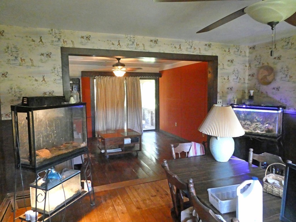 496 Wareham Street Middleboro, MA 02346 - Photo 16 of 34 a living room with furniture and a chandelier