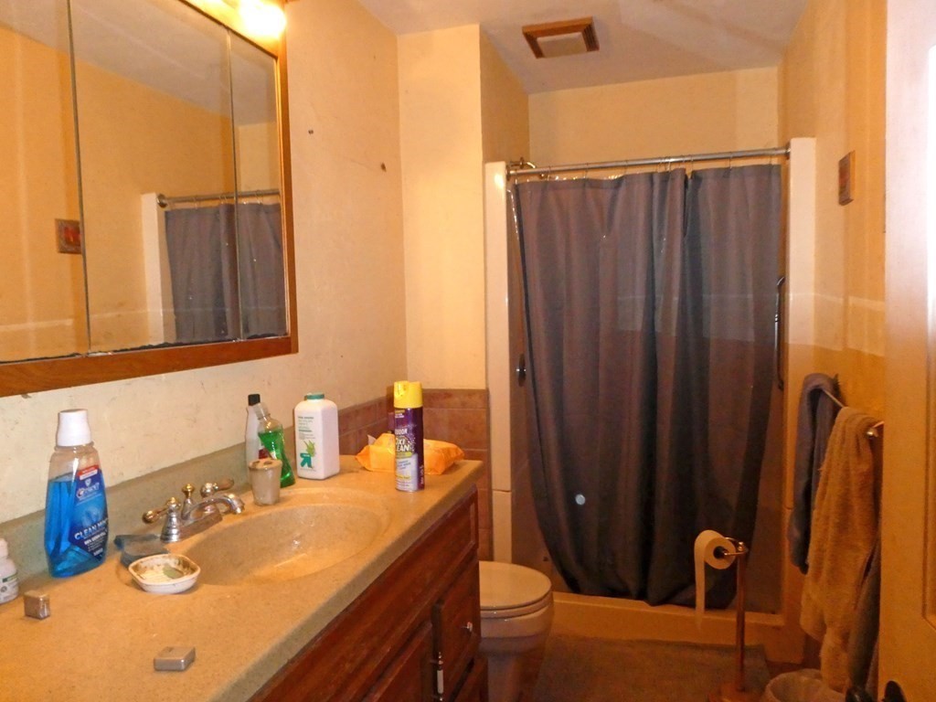 496 Wareham Street Middleboro, MA 02346 - Photo 28 of 34 a bathroom with a sink and a mirror