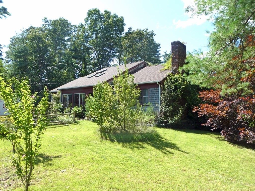 496 Wareham Street Middleboro, MA 02346 - Photo 5 of 34 a view of a house with a yard and sitting area