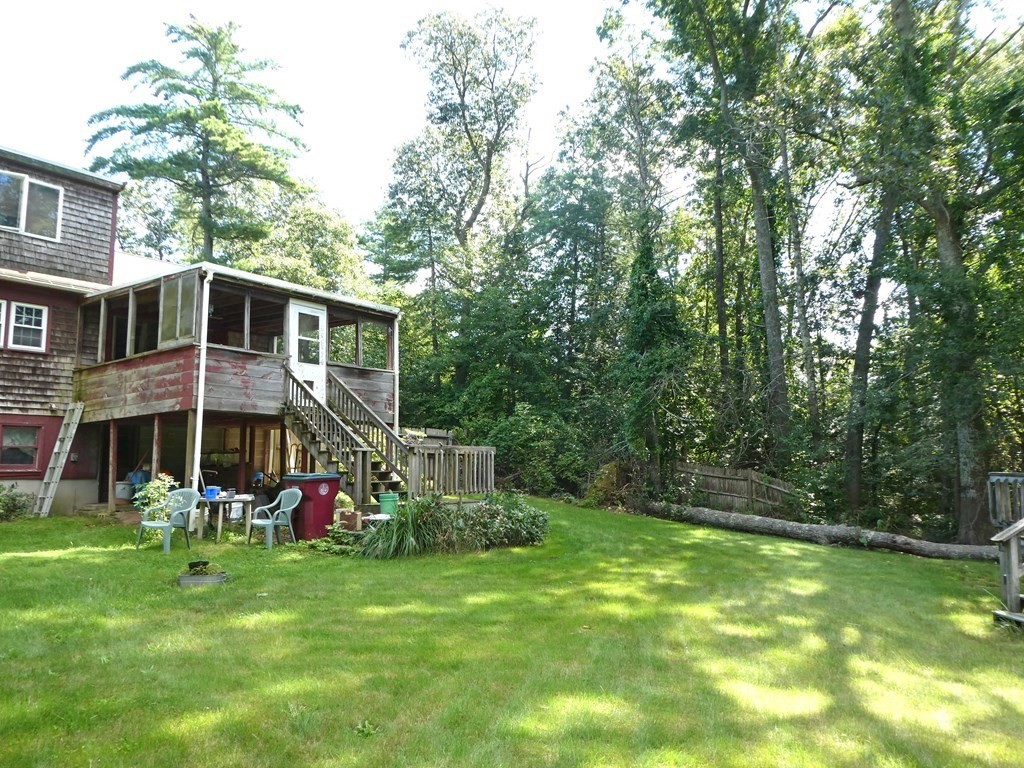 496 Wareham Street Middleboro, MA 02346 - Photo 7 of 34 a view of a house with a big yard and large trees