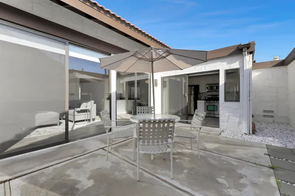 a patio with yard and patio