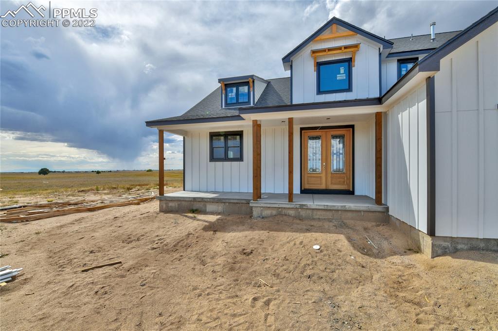 2420 North Log Road Calhan, CO 80808 - Photo 20 of 47 a view of a house with a ocean view