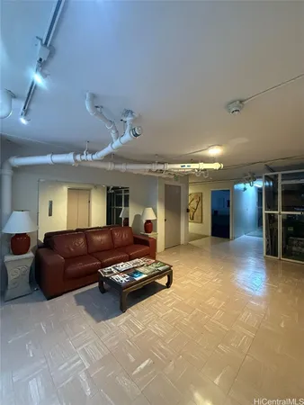 a living room with furniture a flat screen tv and couches
