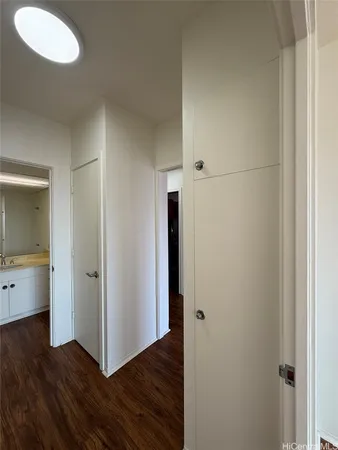 a view of hallway with wooden floor
