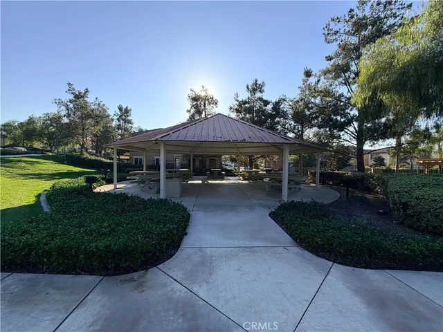 an aerial view of residential houses with outdoor space and swimming pool