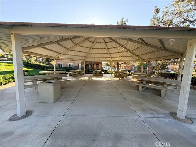 a view of a house with a yard and tree s