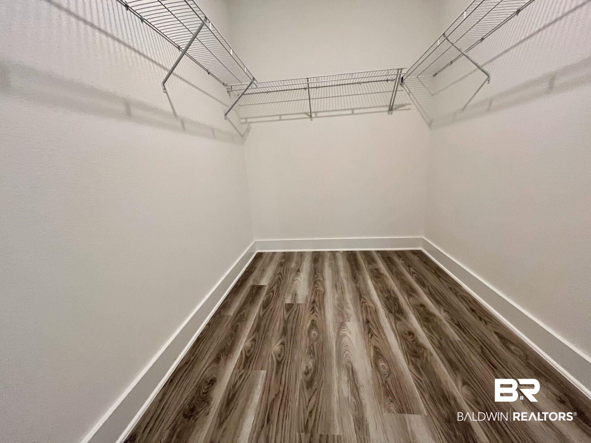 334 Barndling Street Fairhope, AL 36532 - Photo 30 of 34 Spacious closet with wood-type flooring