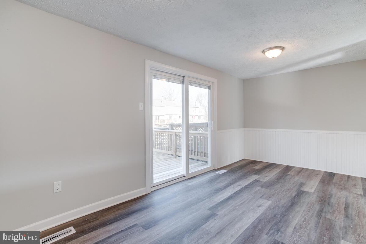 1308 Apple Ridge Court Edgewood, MD 21040 - Photo 13 of 38 wooden floor in an empty room with a window